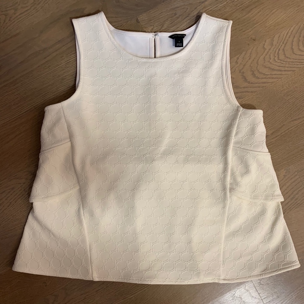 White top with ruffles in back